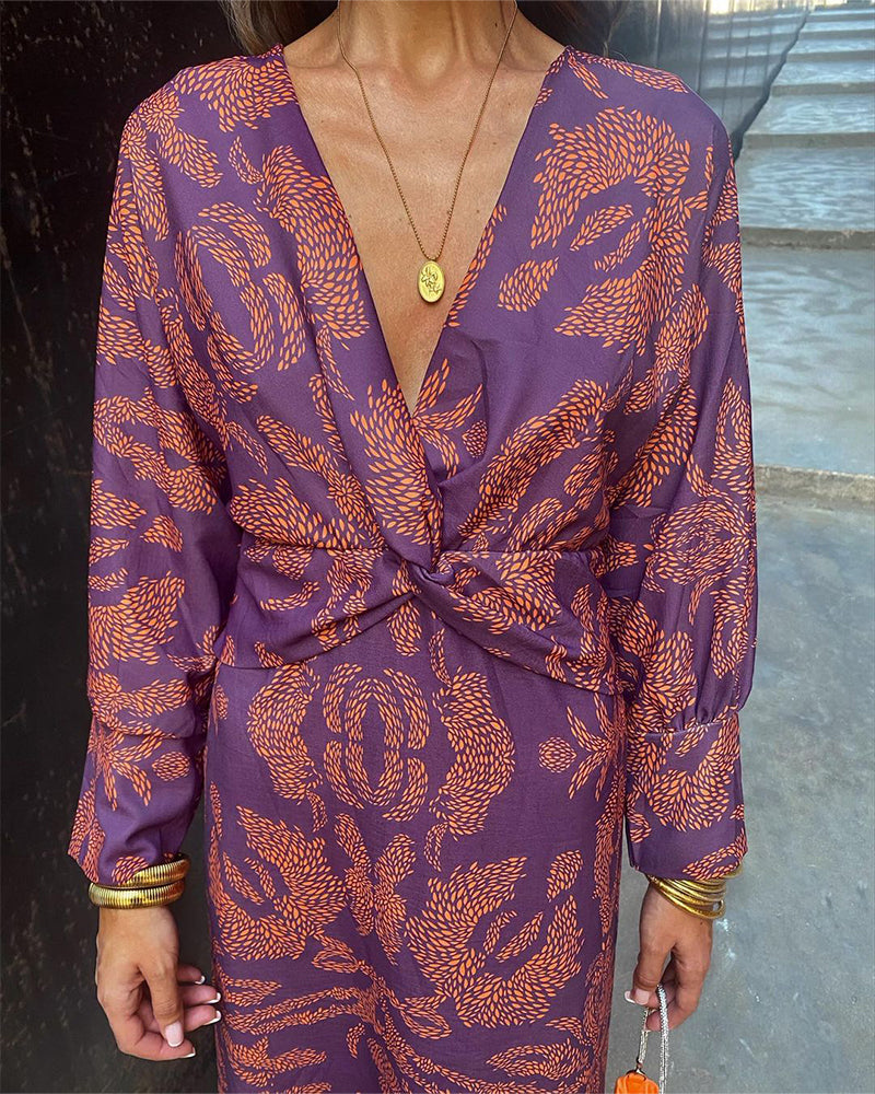Classy long sleeve printed V-neck midi dress for women, versatile for cocktails & evening wear.