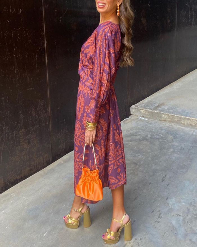 Women's elegant printed V-neck midi cocktail dress, perfect for sophisticated evening & party wear.