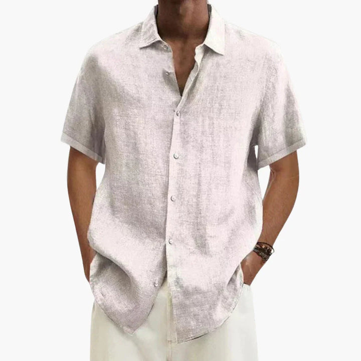 Relaxed fit men's summer short sleeve button-up shirt. Perfect for warm weather, casual outings, and everyday style.