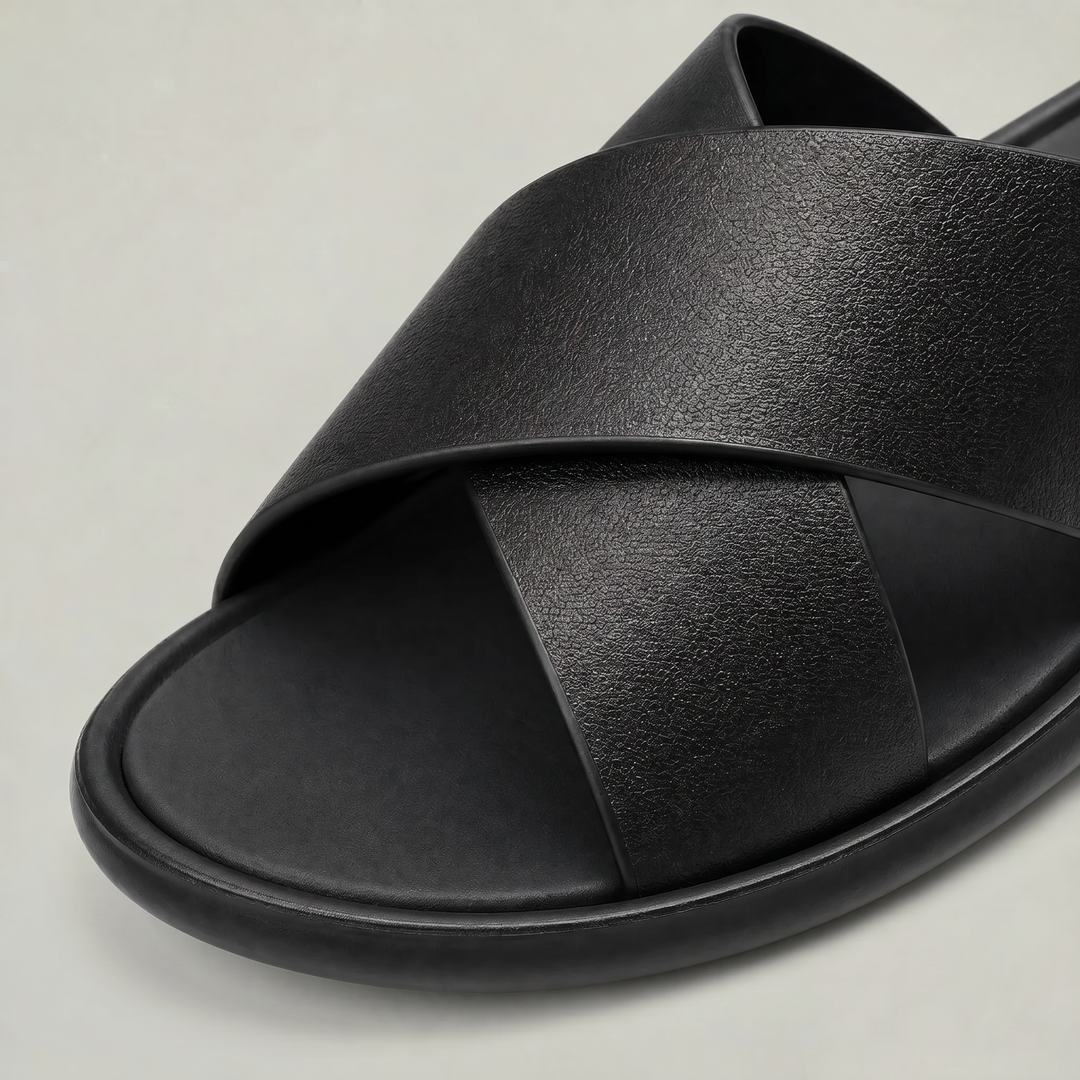 Comfortable men's slip-on cross strap slides, ideal for everyday casual footwear. Relaxed design.