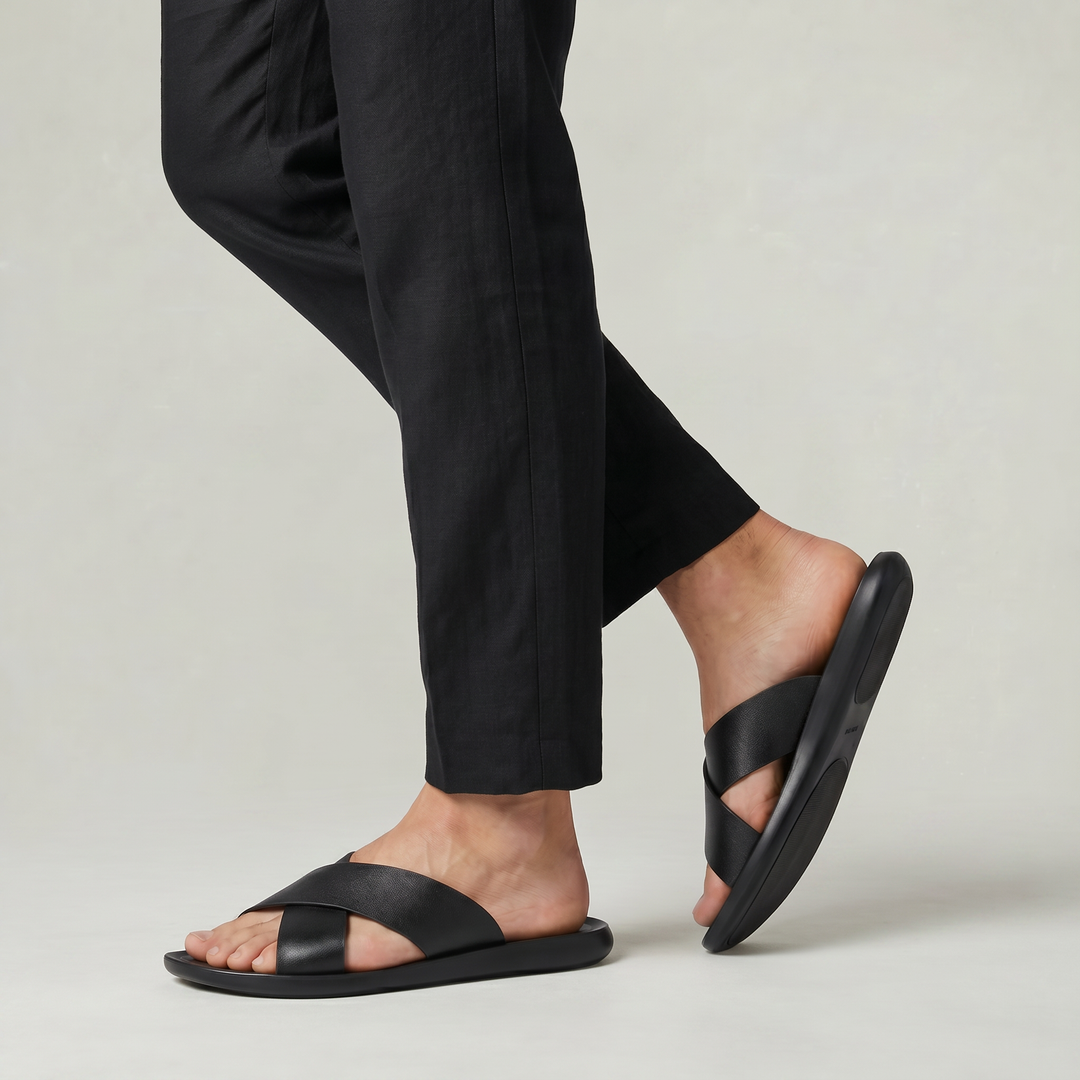 Men's black cross strap sandals offering a relaxed fit & all-day comfort. Versatile casual slides.