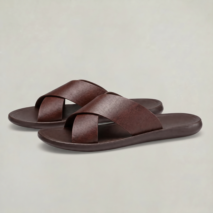 Everyday men's comfort slides featuring a cross strap design. Cushioned black sandals for casual wear.