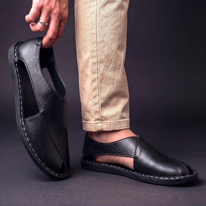 Stylish men's slip-on fisherman sandals with intricate stitching, perfect for versatile summer and warm weather comfort.