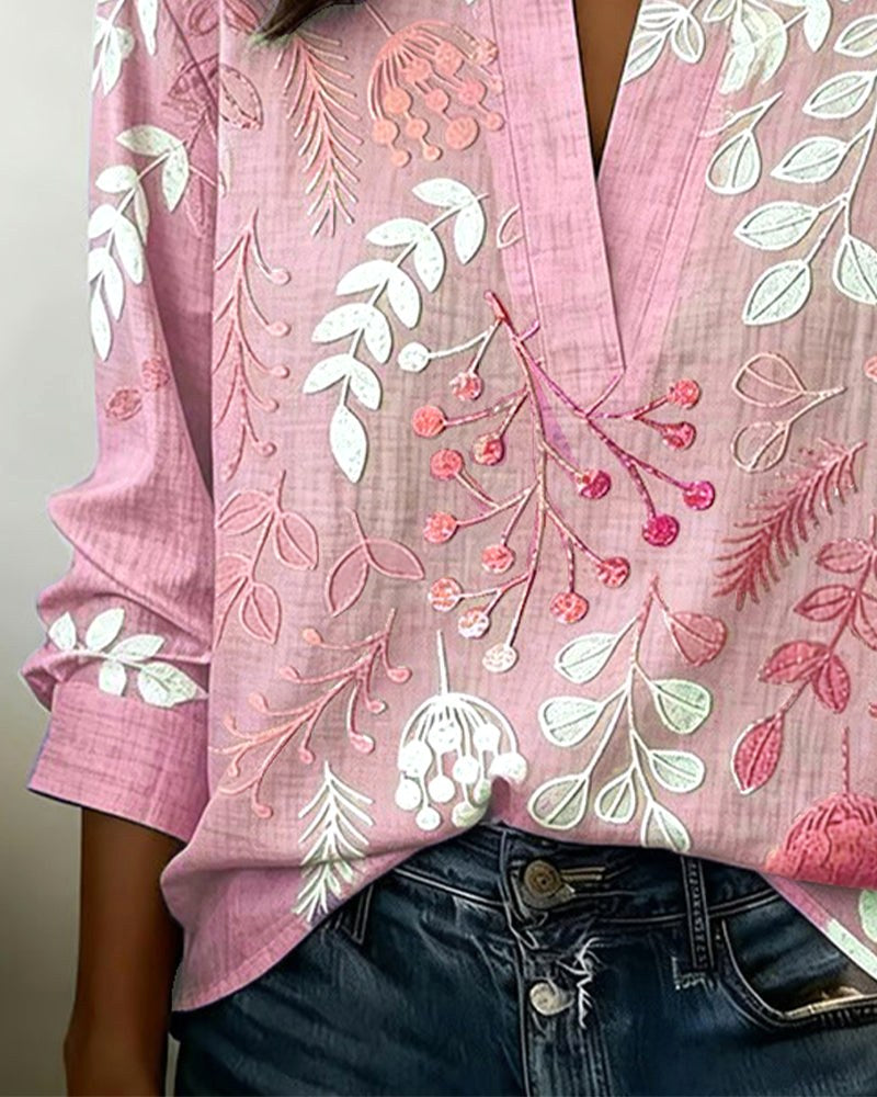 Modern women's floral V-neck top, a lightweight and stylish addition to any spring/summer wardrobe.