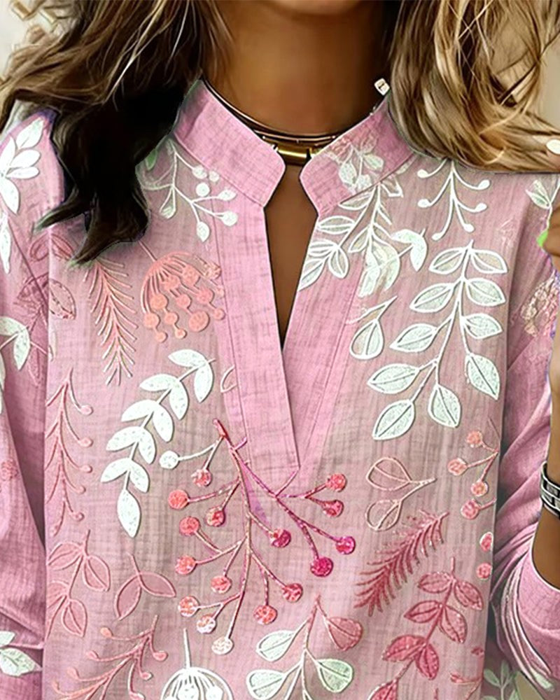 Chic women's V-neck blouse with delicate floral print, perfect for a sophisticated casual outfit.