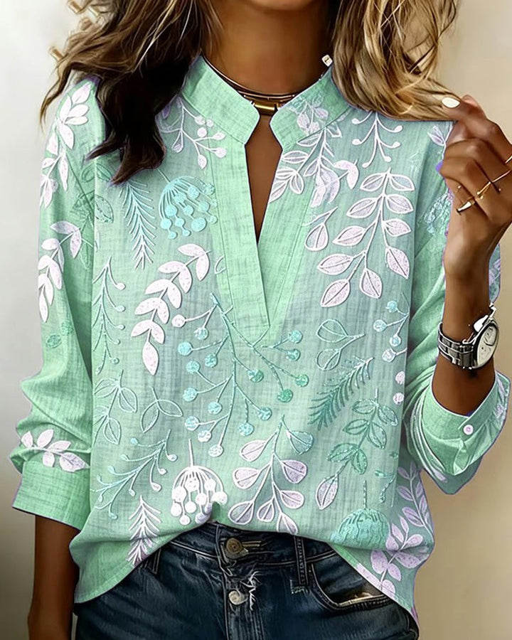 Breathable floral V-neck blouse for women, lightweight & stylish for effortless warm-weather comfort.