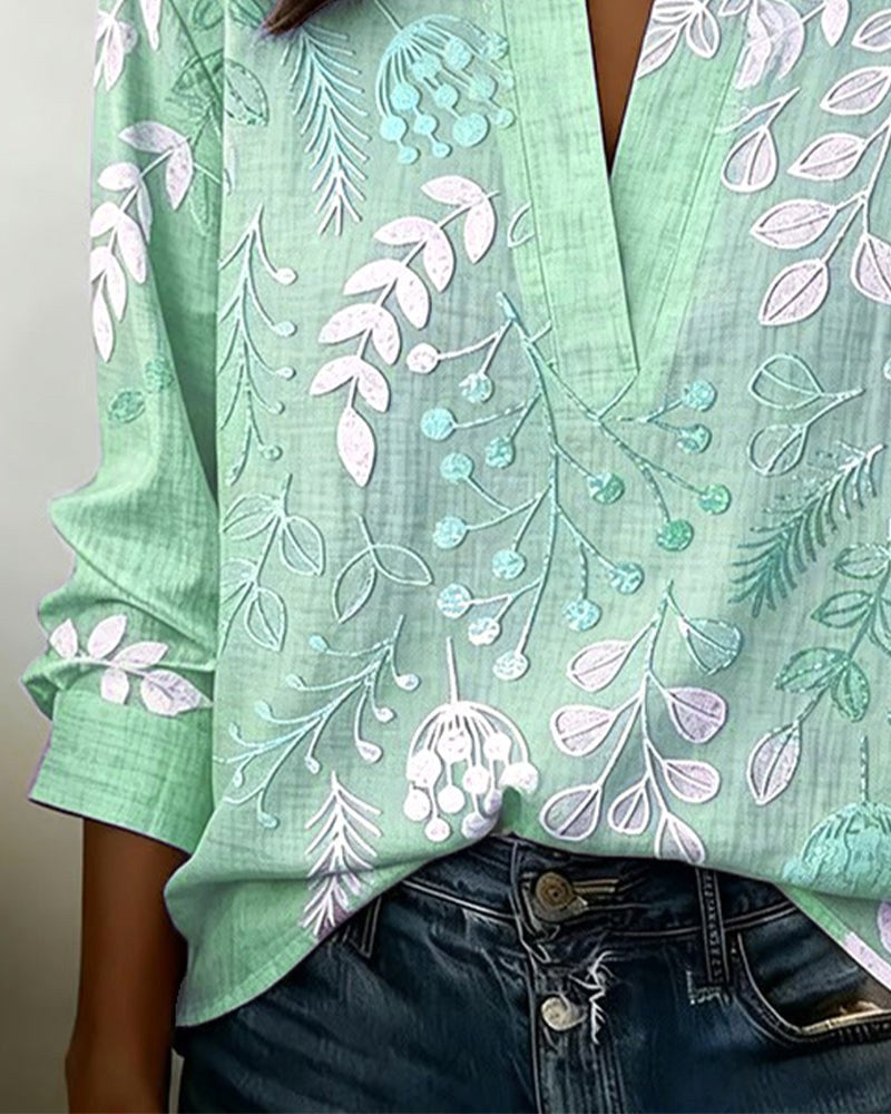 Stylish women's floral V-neck top, lightweight comfort & vibrant design for warm weather fashion.