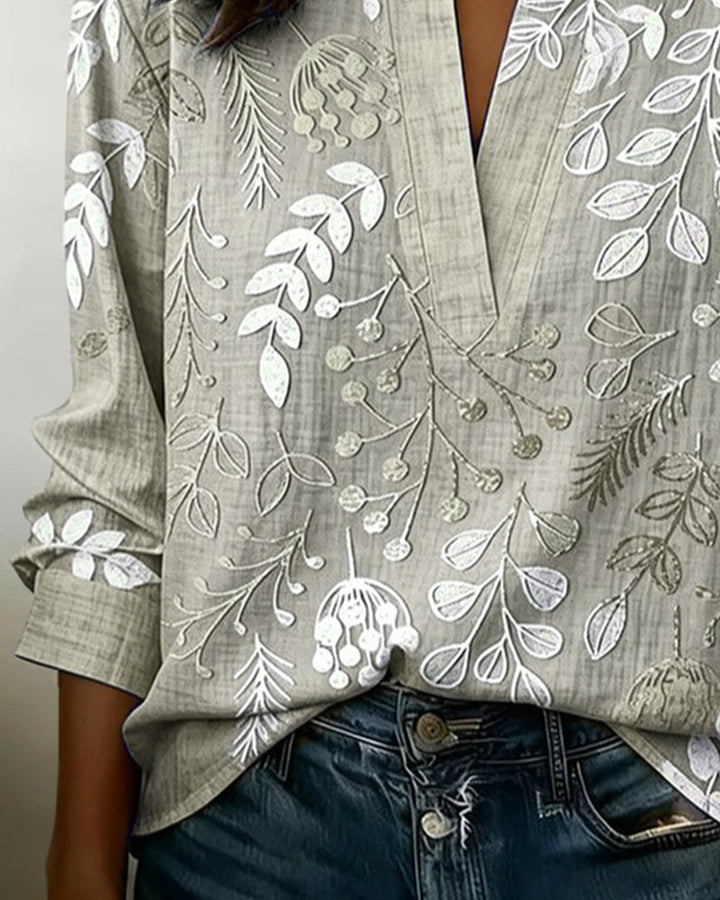 Beautiful women's floral V-neck blouse, flattering design & comfortable for all-day wear.