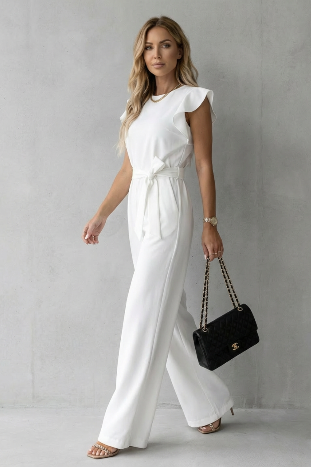 Sophisticated women's jumpsuit with wide legs & ruffles, ideal for office wear, parties, or elegant evenings.
