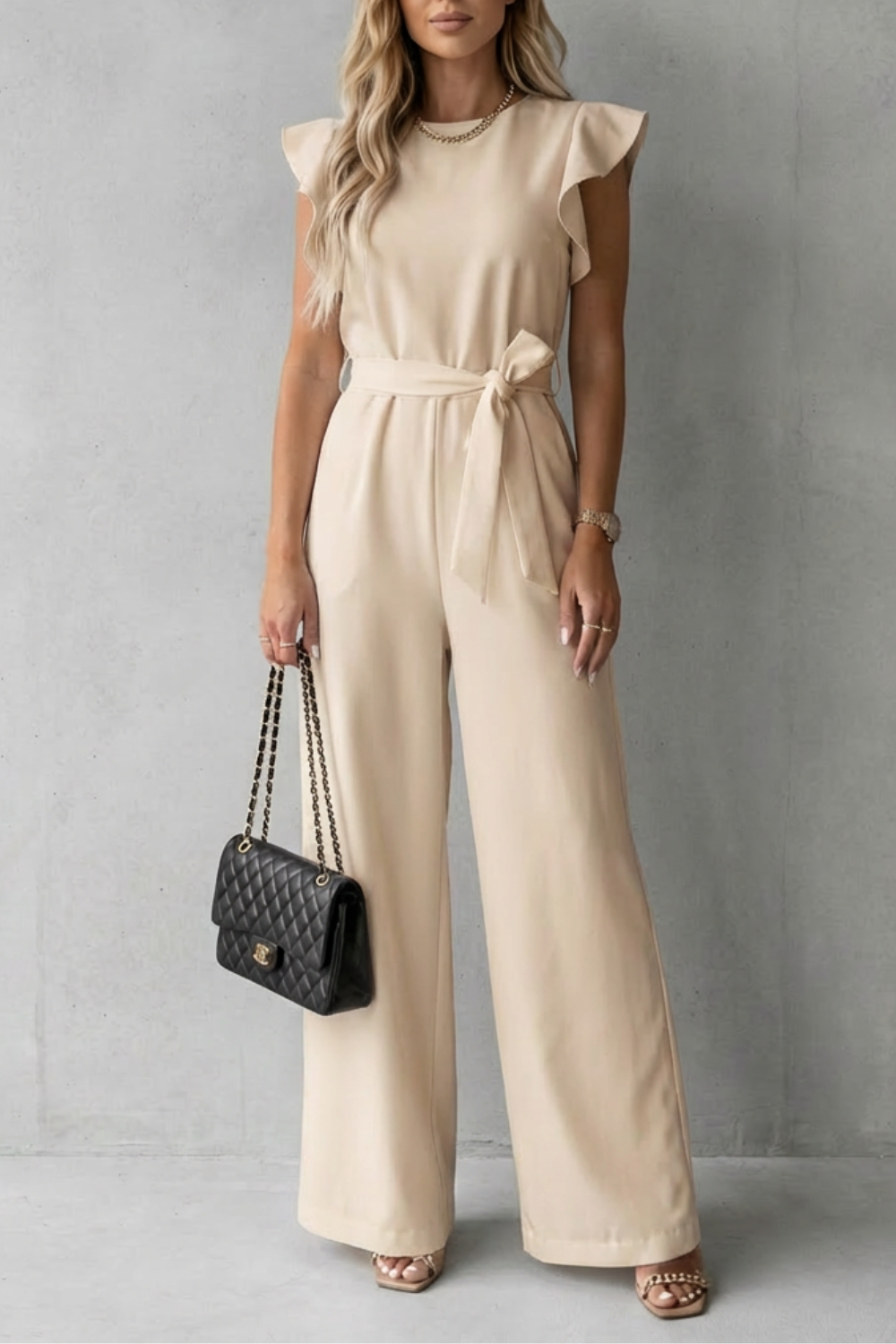 Comfortable yet elegant women's wide-leg belted jumpsuit with ruffle sleeves. Ideal for all-day chic.