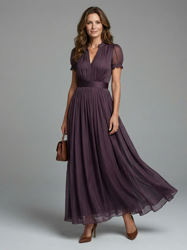 Elegant dark purple women's party maxi dress with pleated waist, sheer sleeves & lace neckline for special occasions.