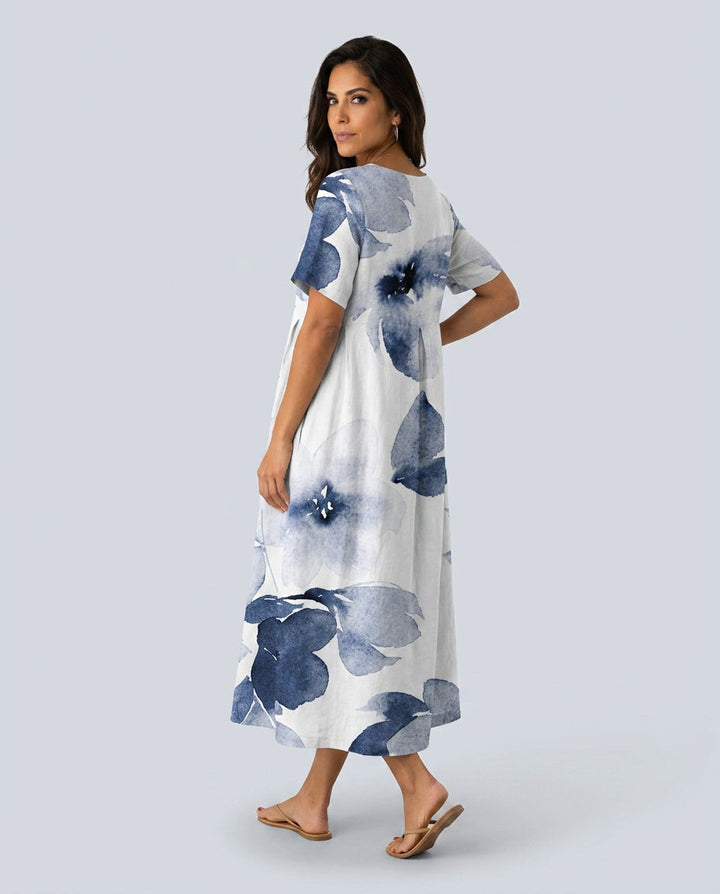Flowy women's floral boho maxi dress with short sleeves & round neck, perfect for summer vacation.