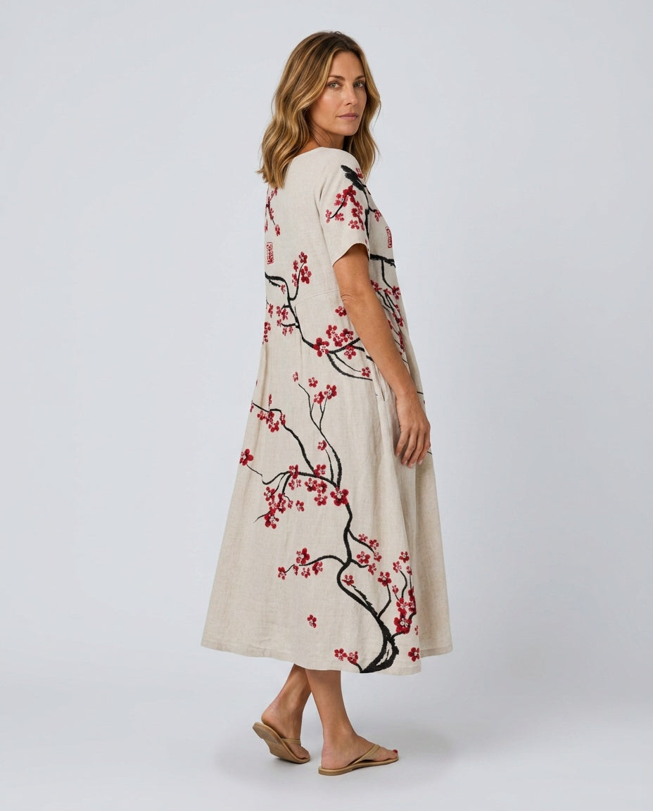Boho chic floral maxi dress for women, with a flowy silhouette and short sleeves, great for summer.