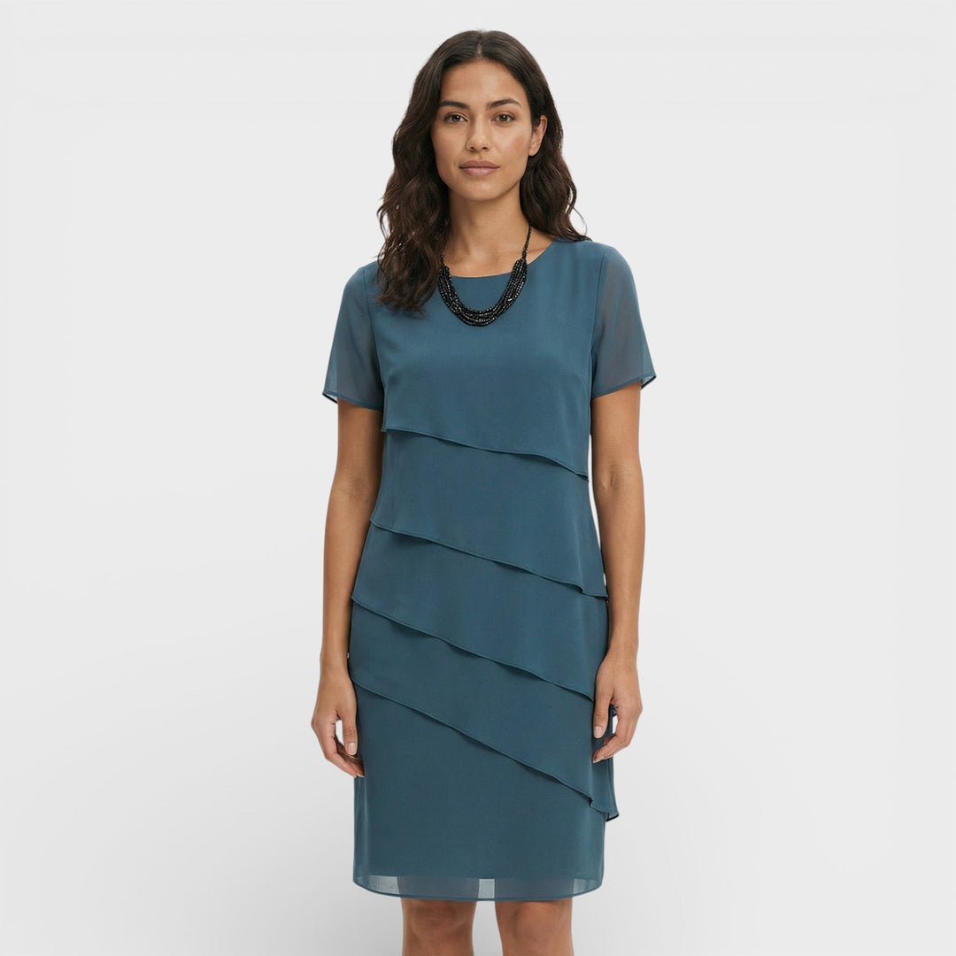 Women's elegant layered ruffle midi cocktail dress for special occasions. Timeless evening party wear.