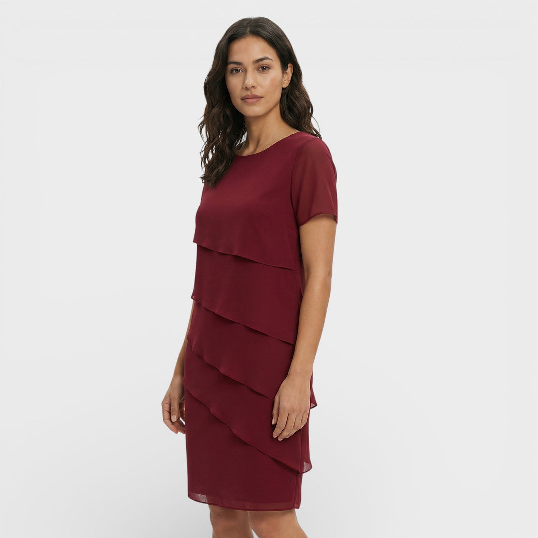 Timeless women's formal midi dress with beautiful layered ruffles. Elegant cocktail and evening party.