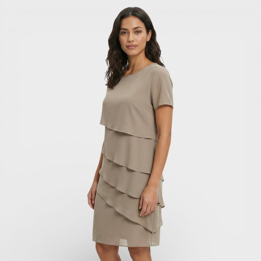 Women's sophisticated layered ruffle midi for cocktails. Chic party dress for elegant evening wear.
