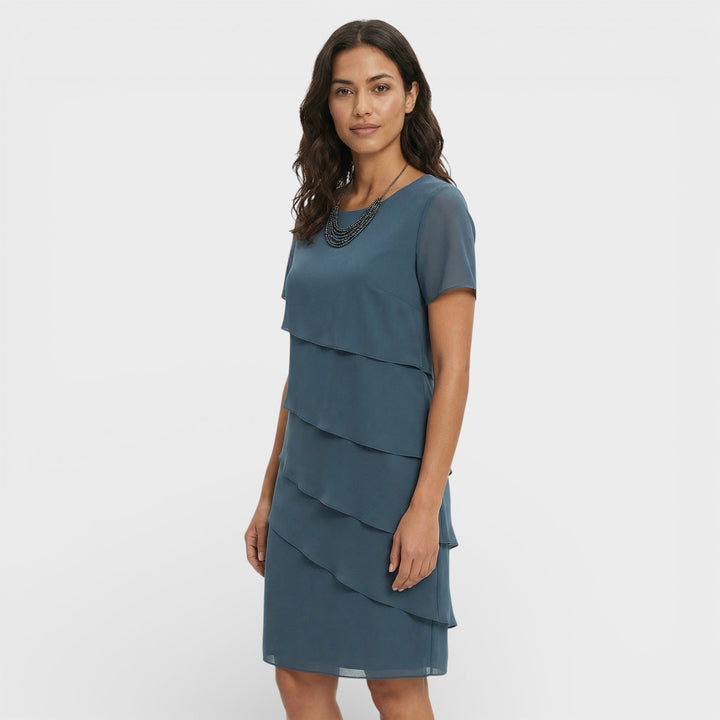 Sophisticated women's cocktail dress, featuring layered ruffles and a midi length. Great for evenings.