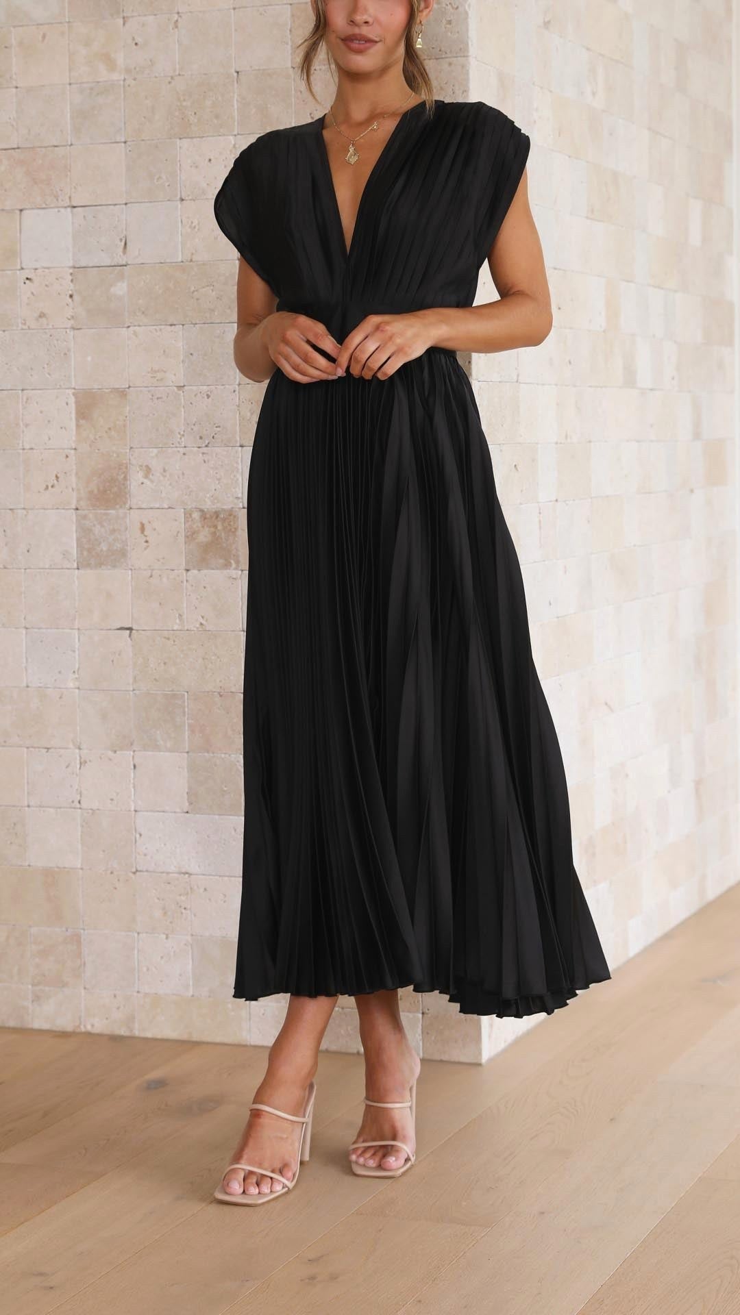 Flowy pleated maxi dress for women, embodying elegant summer fashion.