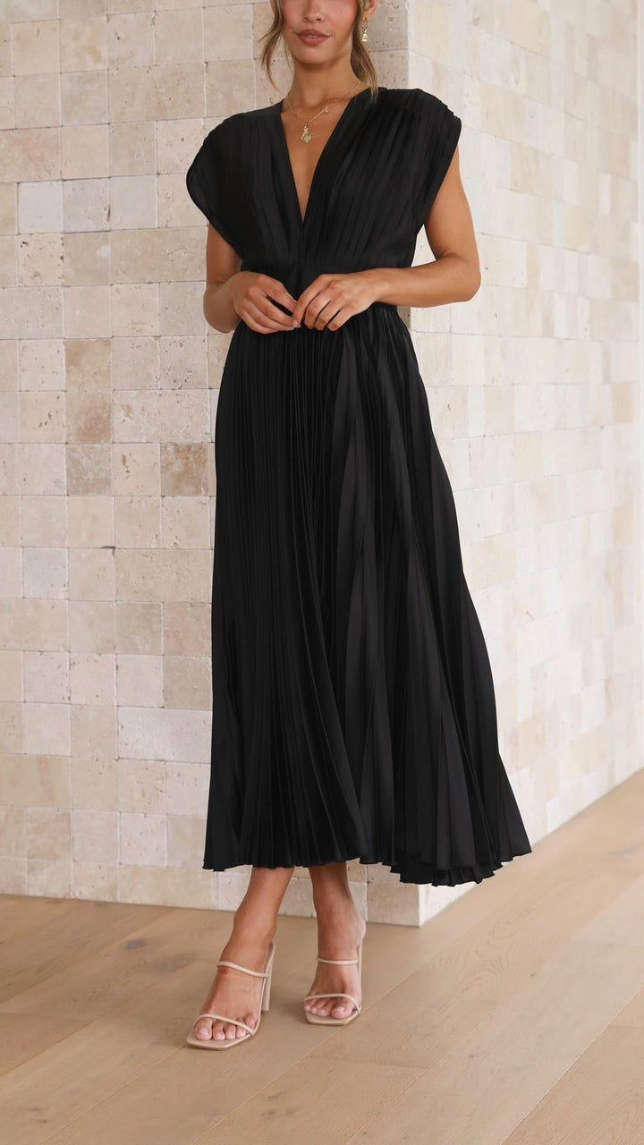 Flowy pleated maxi dress for women, embodying elegant summer fashion.