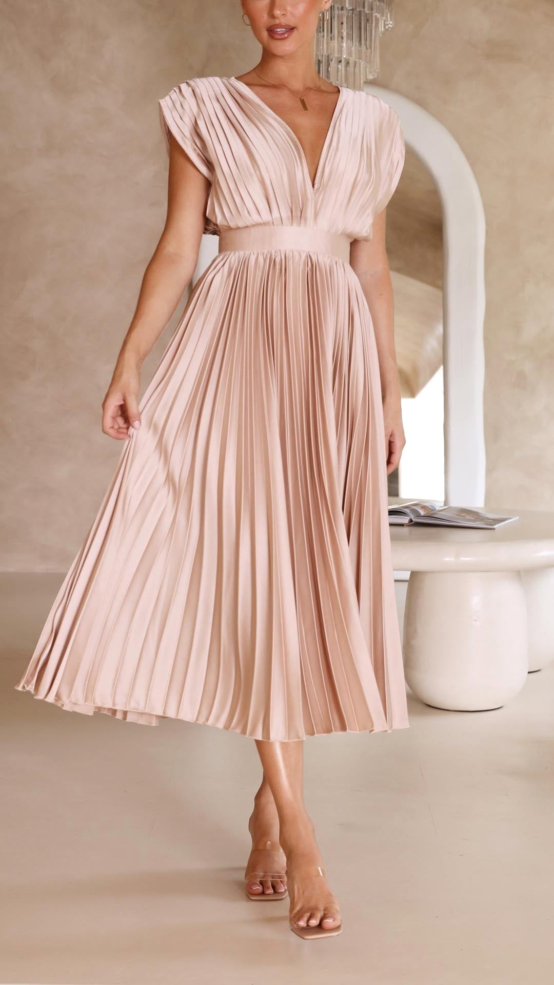 Women's elegant holiday dress, a long flowy pleated maxi for summer.