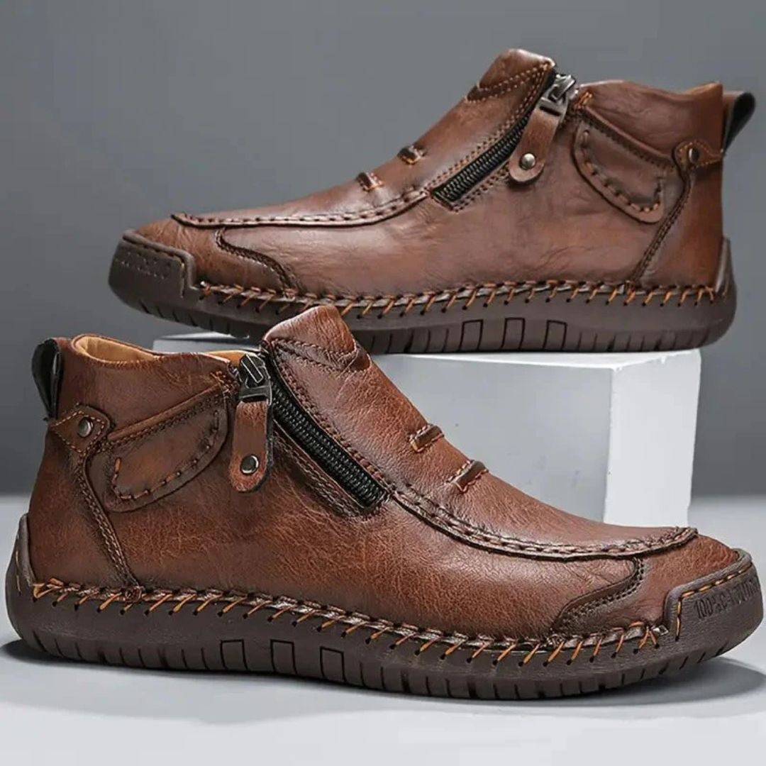 Men's relaxed fit orthopedic ankle boots with side zip closure for easy, comfortable wear.