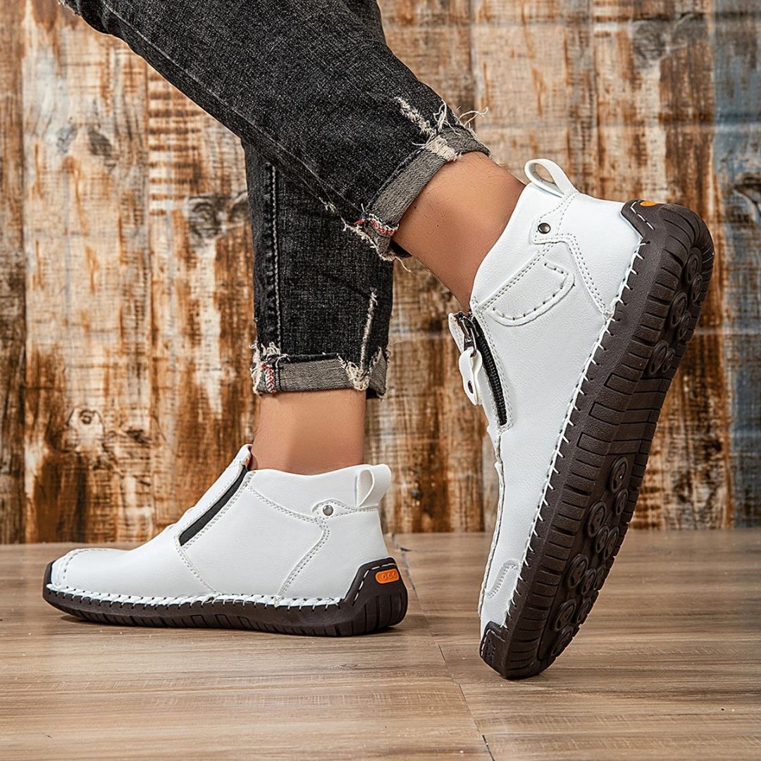 Durable men's orthopedic ankle boots, featuring a relaxed fit, side zip & stitching for long-lasting comfort.