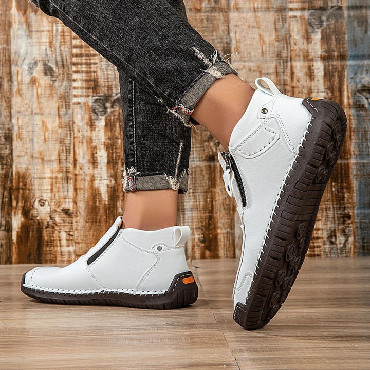 Durable men's orthopedic ankle boots, featuring a relaxed fit, side zip & stitching for long-lasting comfort.