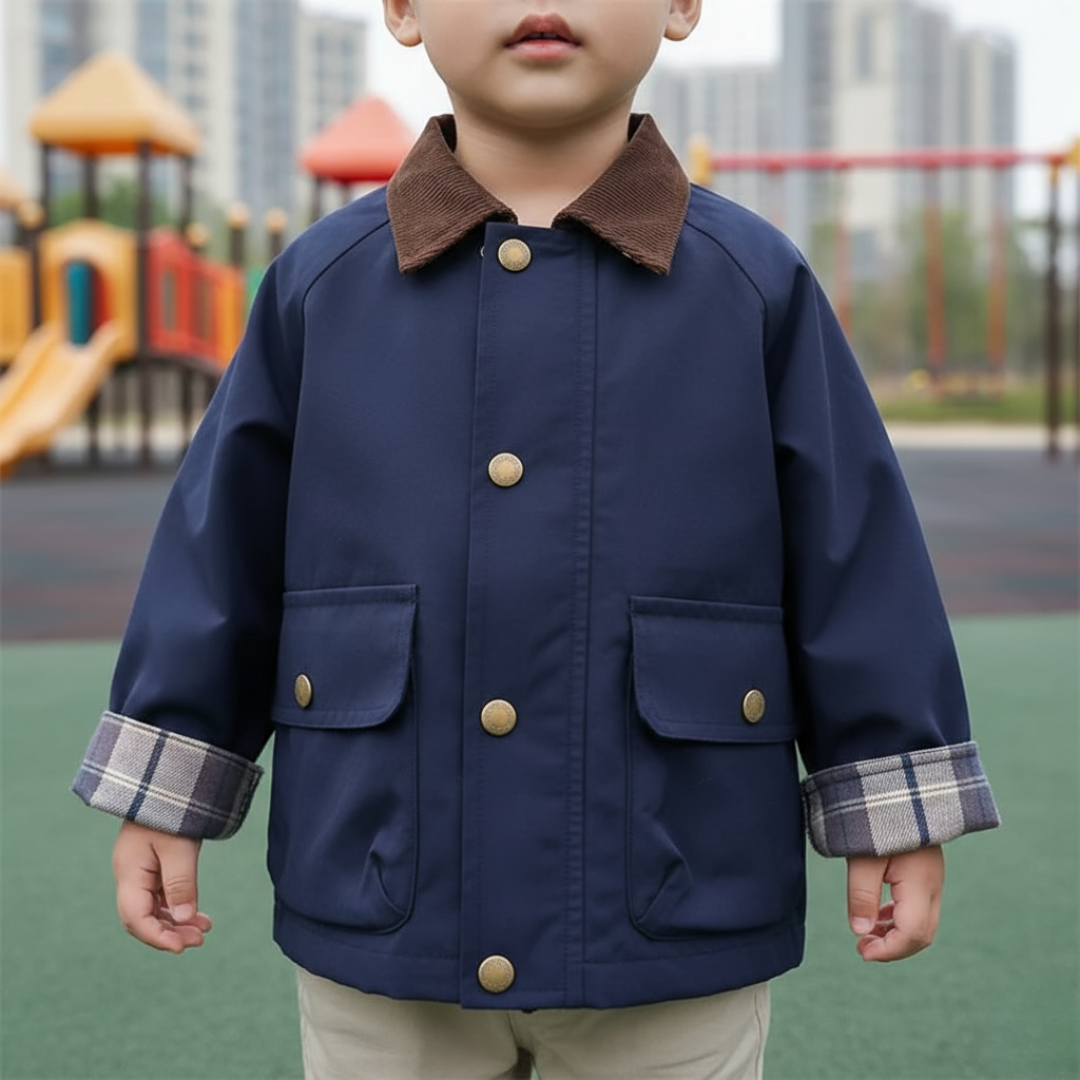 Stylish boys' jacket with unique plaid cuffs. A fashionable choice for kids' casual outfits.