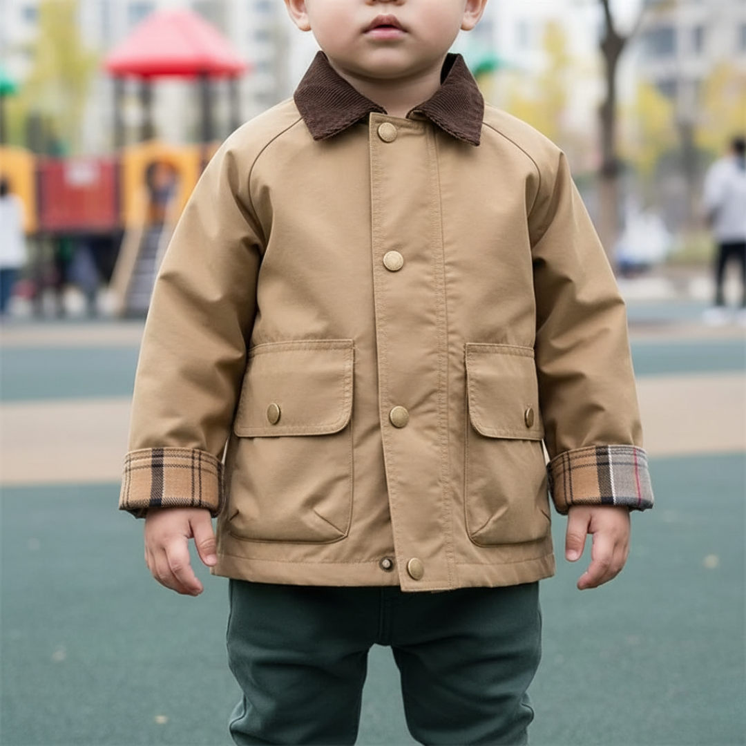 Button-down boys' jacket with fashionable plaid cuffs. Durable & stylish youth outerwear.