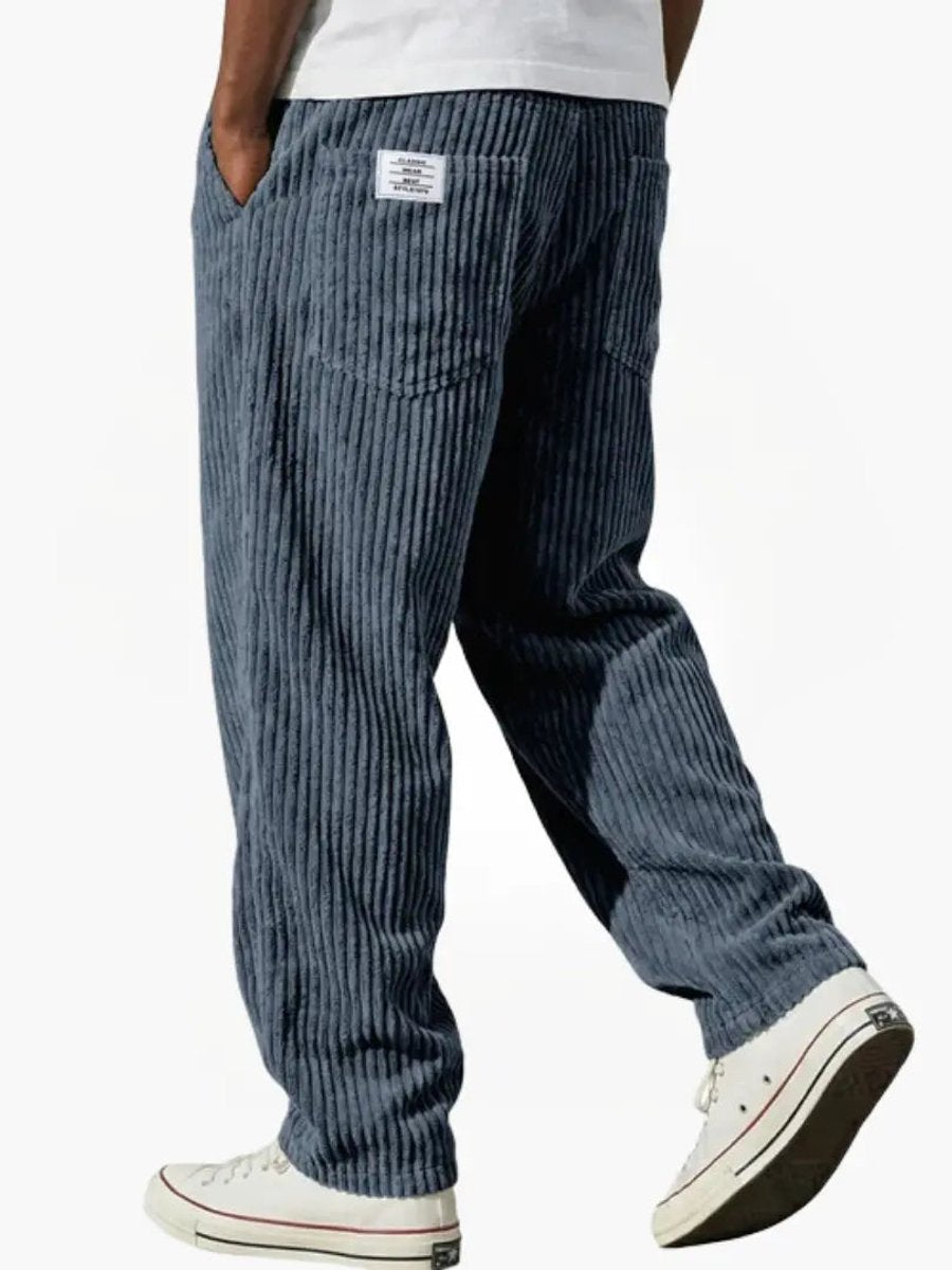 Comfortable men's relaxed fit corduroy trousers featuring an elastic waist and straight leg design.