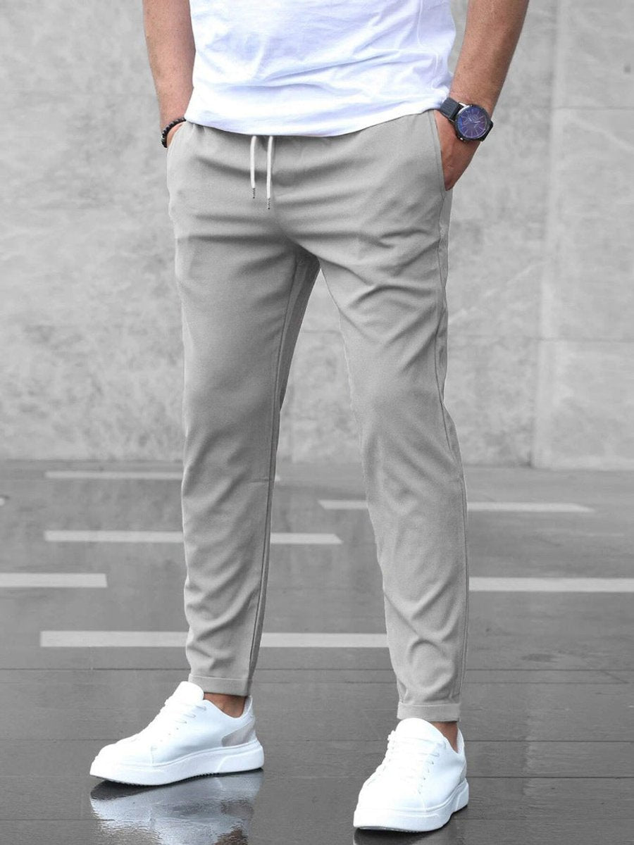 Men's slim-fit jogger chinos with comfortable drawstring waist, versatile for casual or business casual outfits.