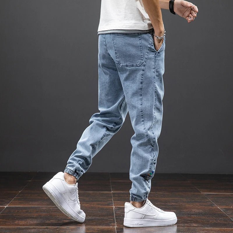 Blue denim joggers for men, offering ultimate stretch comfort & a relaxed fit; perfect for everyday casual wear.