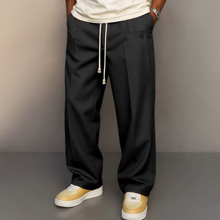 Relaxed fit men's khaki wide leg pants with an adjustable drawstring waist for ultimate comfort and style.