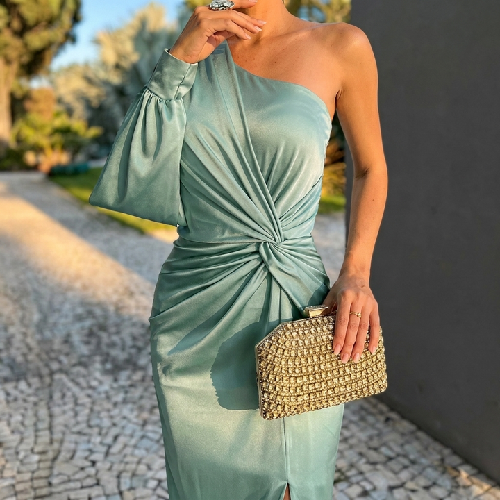 Sophisticated women's one shoulder evening gown, a modern figure-flattering party dress.