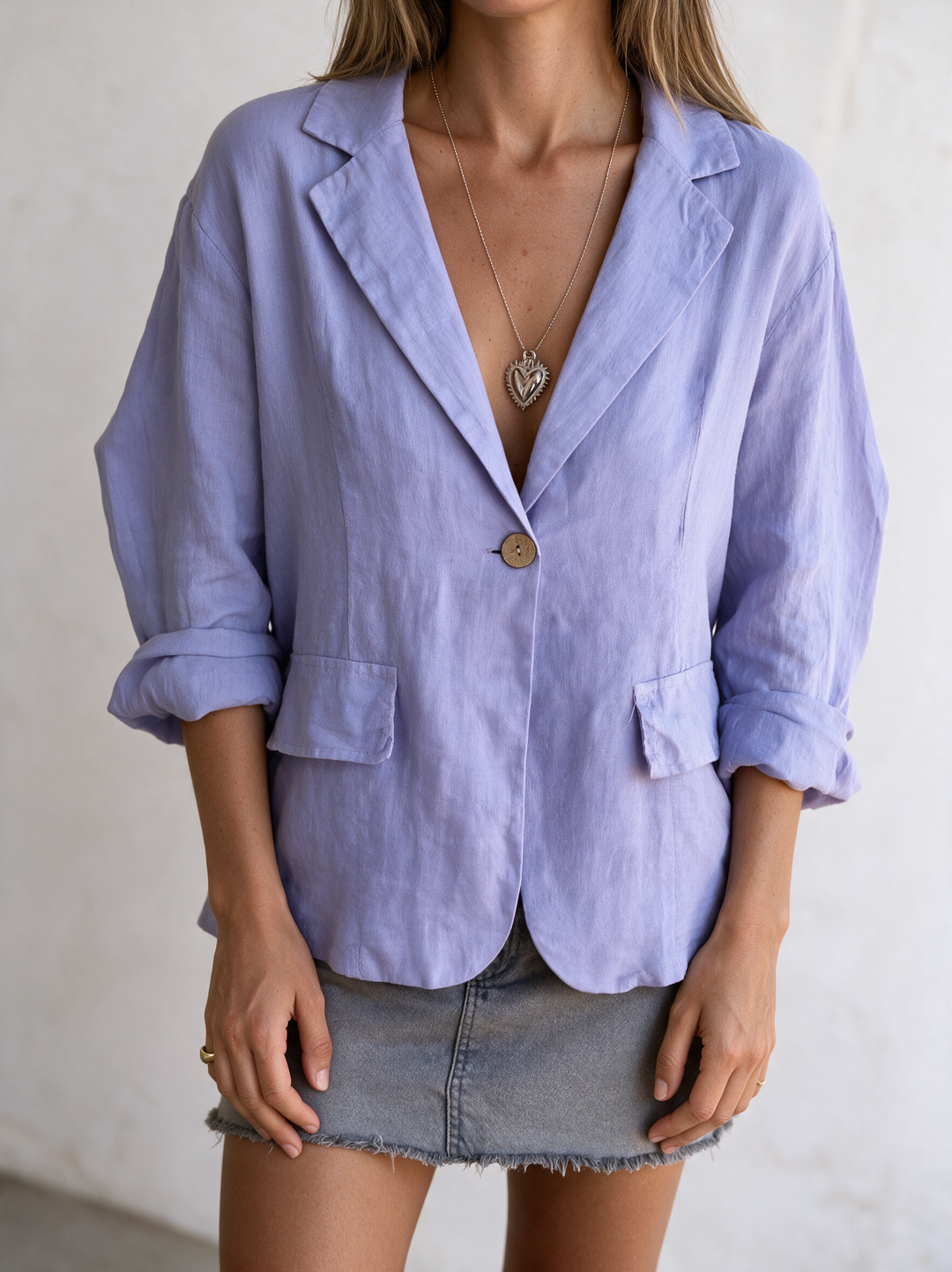 Chic women's minimalist blazer, perfect lightweight layering piece for a sophisticated look.