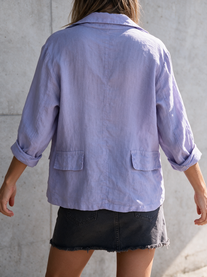 Versatile women's blazer in a classic minimalist design, ideal for business casual style.
