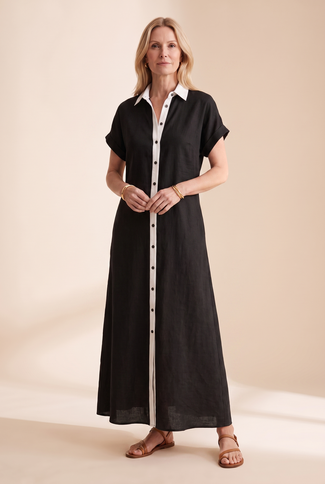 Casual women's short-sleeve collared shirt dress with full button front, ideal for summer fashion.