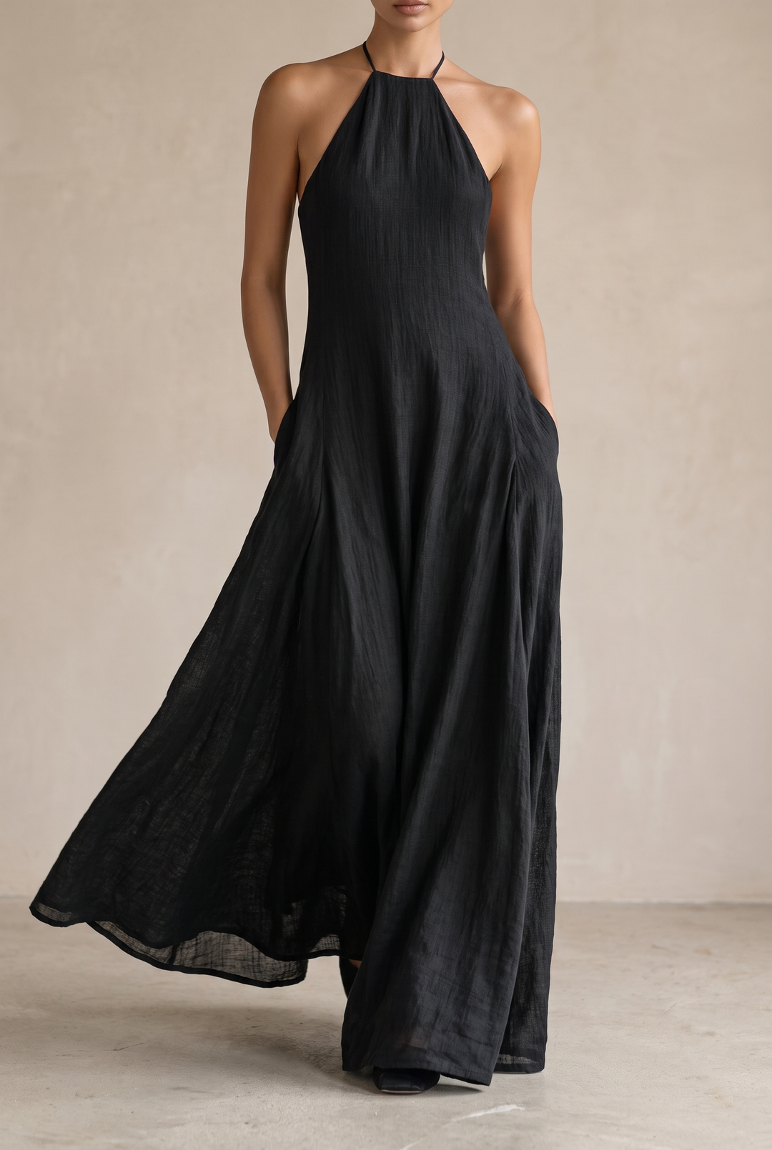 Elegant women's black halter maxi dress, perfect for evening wear or chic daytime events. Flowy & comfortable.