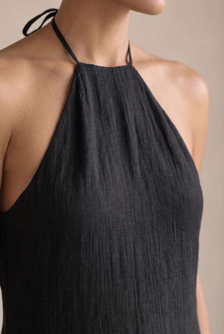 Classic black women's maxi dress with an elegant halter neck. Comfortable, flowy, and perfect for a stylish summer look.