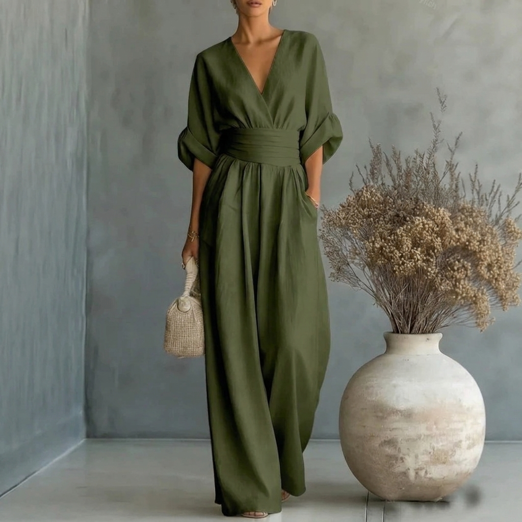 Solid color women's V-neck jumpsuit with short sleeves and a comfortable wide leg, ideal for relaxed style.