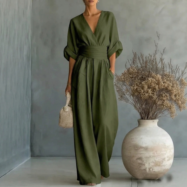 Solid color women's V-neck jumpsuit with short sleeves and a comfortable wide leg, ideal for relaxed style.