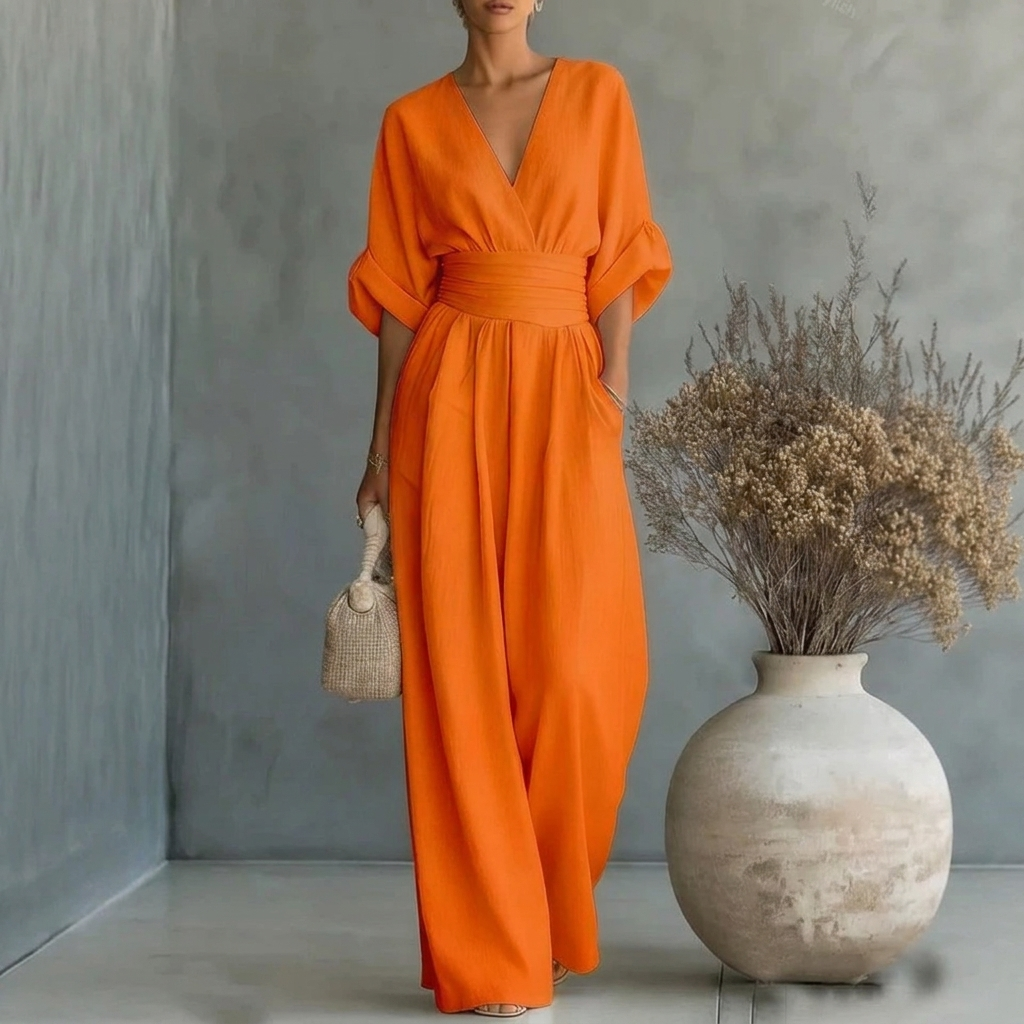 Easy-to-wear women's wide leg jumpsuit. Features a V-neck, short sleeves, and relaxed fit for daily comfort.