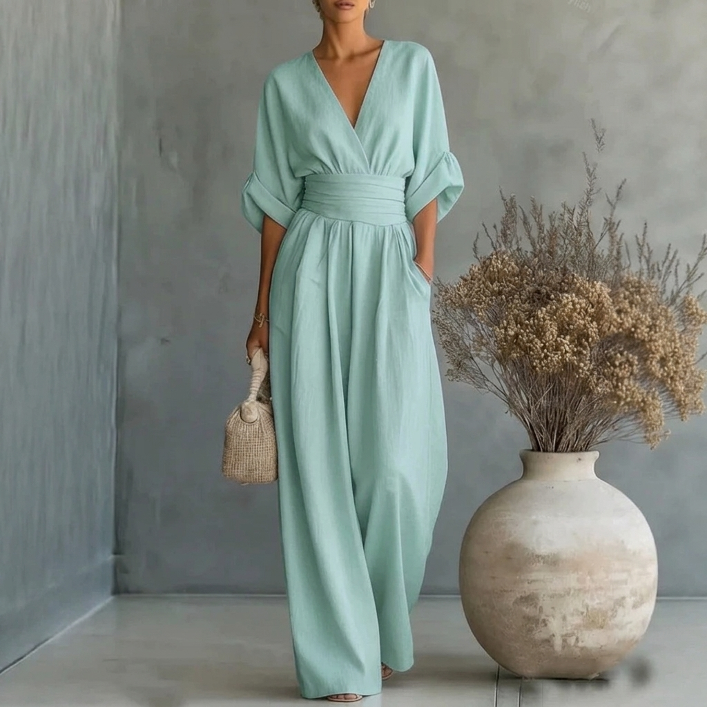 Chic women's wide leg jumpsuit with short sleeves & a V-neck, suitable for travel or relaxed everyday wear.
