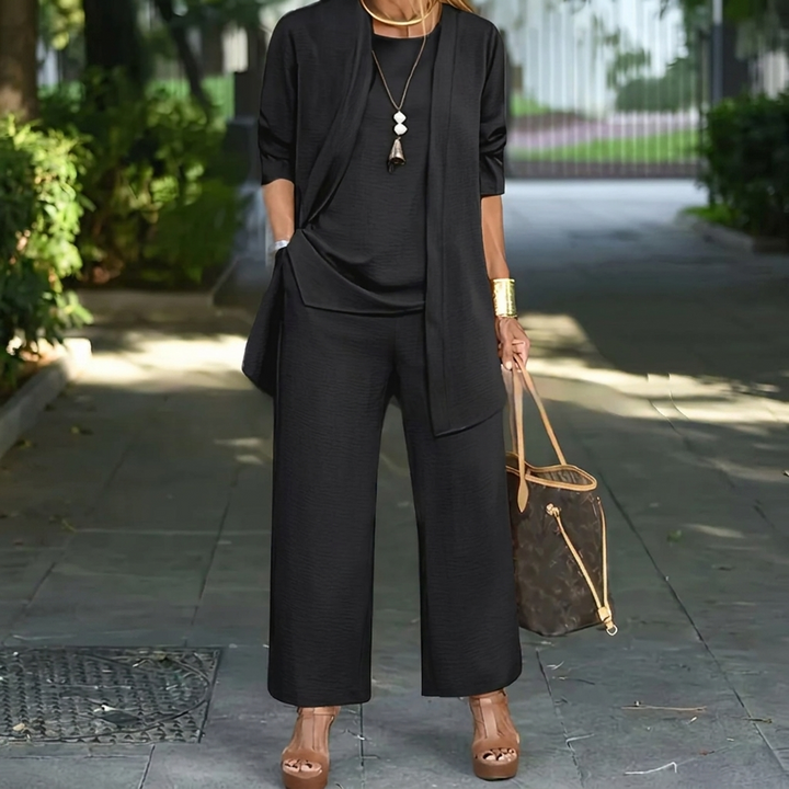 Women's elegant 3-piece set: long cardigan, vest top, and flowy wide leg pants. Versatile layered look.