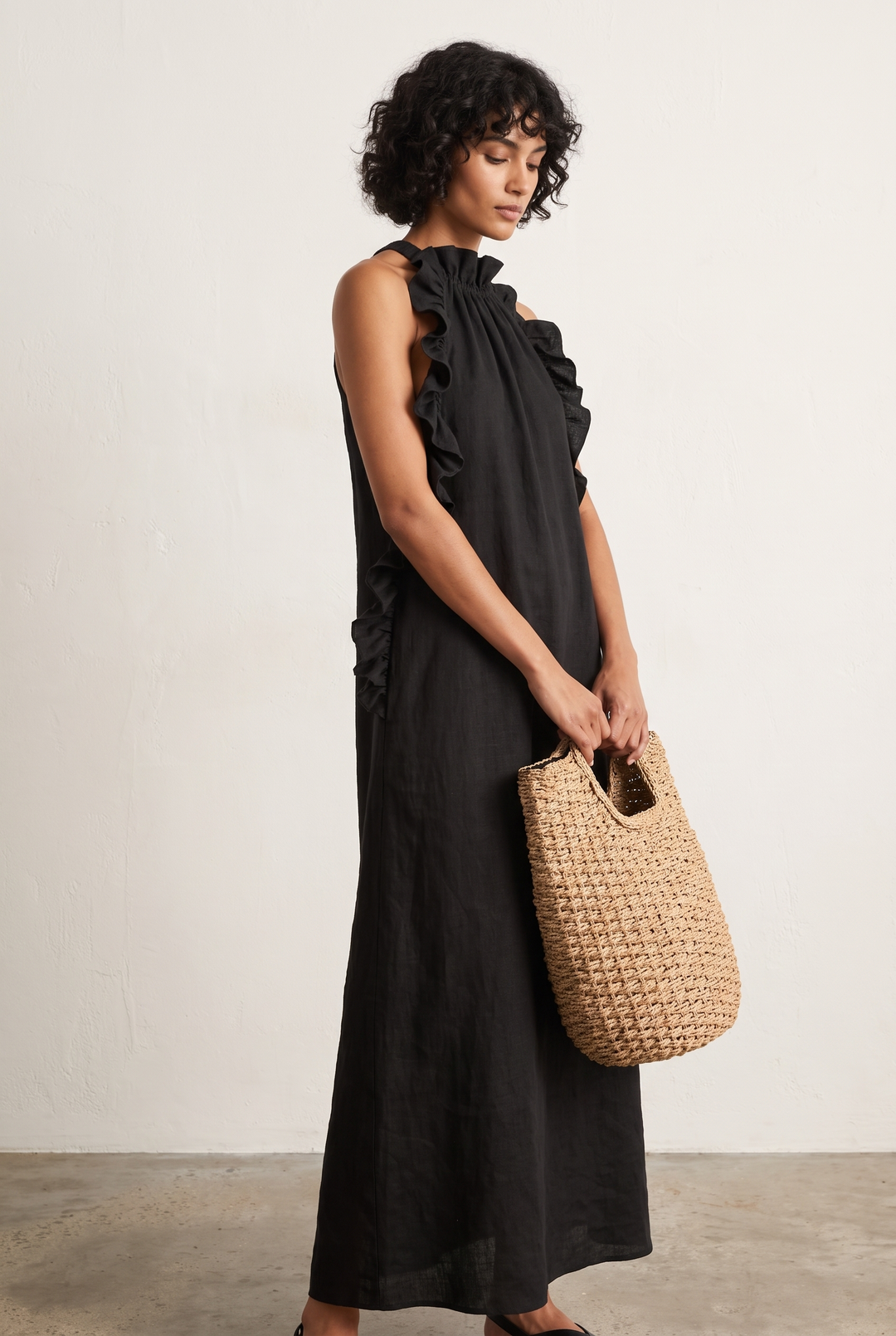Elegant women's flowy ruffle sleeveless maxi dress, perfect for summer occasions or casual wear.