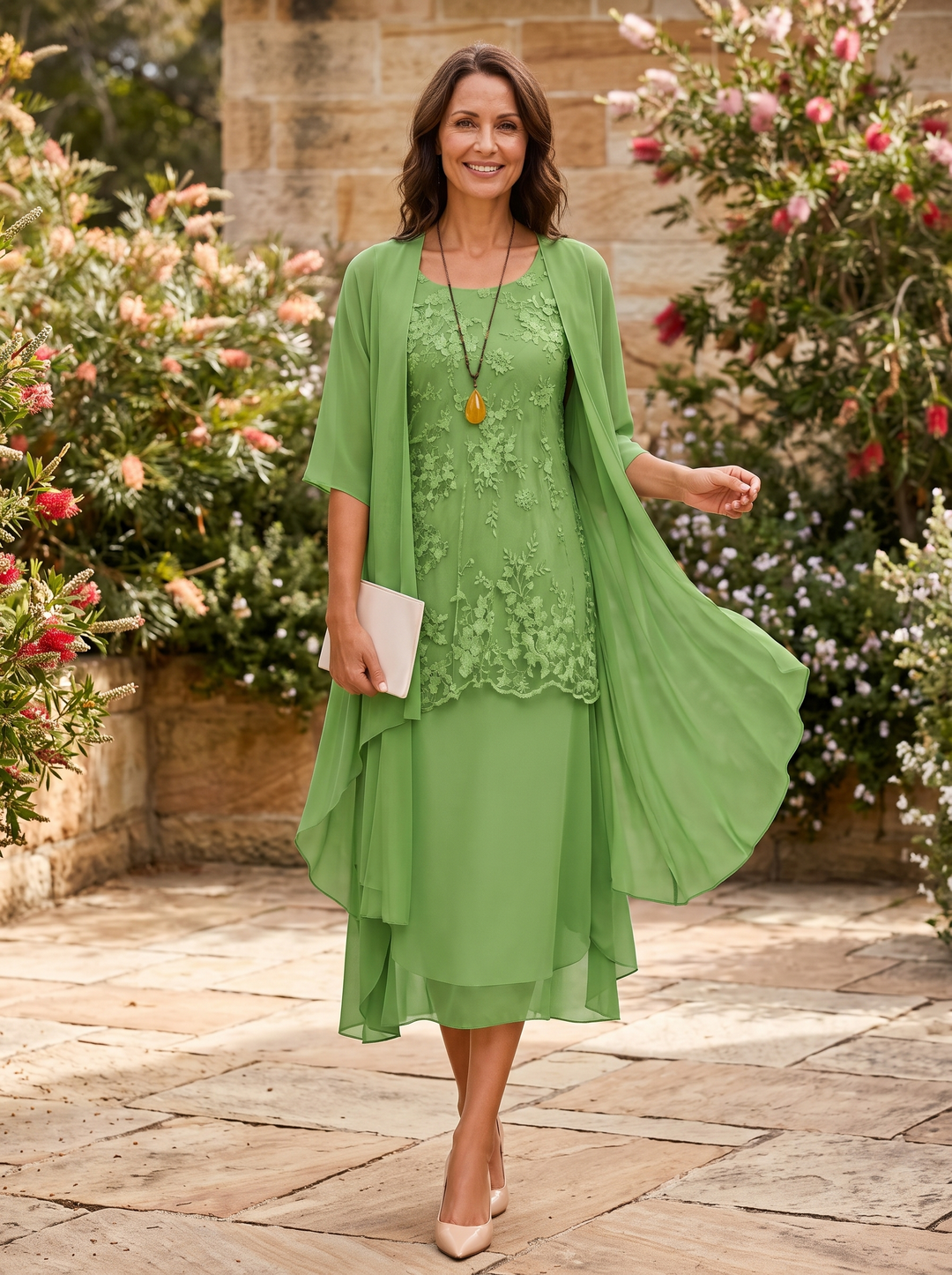 Formal women's two-piece midi dress with elegant jacket, perfect for wedding guest styling.
