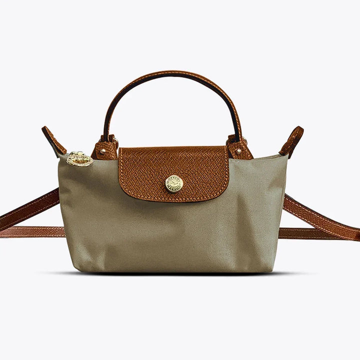 Fashion-forward women's crossbody bag. Adjustable strap allows comfortable wear as shoulder or versatile handbag.