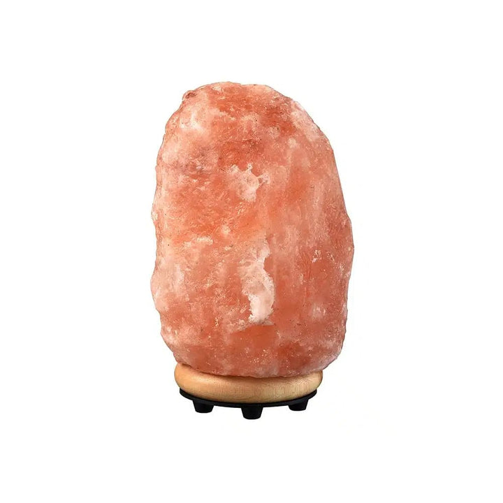 Natural Himalayan Salt Lamp, providing ambient light & acting as an air purifier for a calm wellness space.