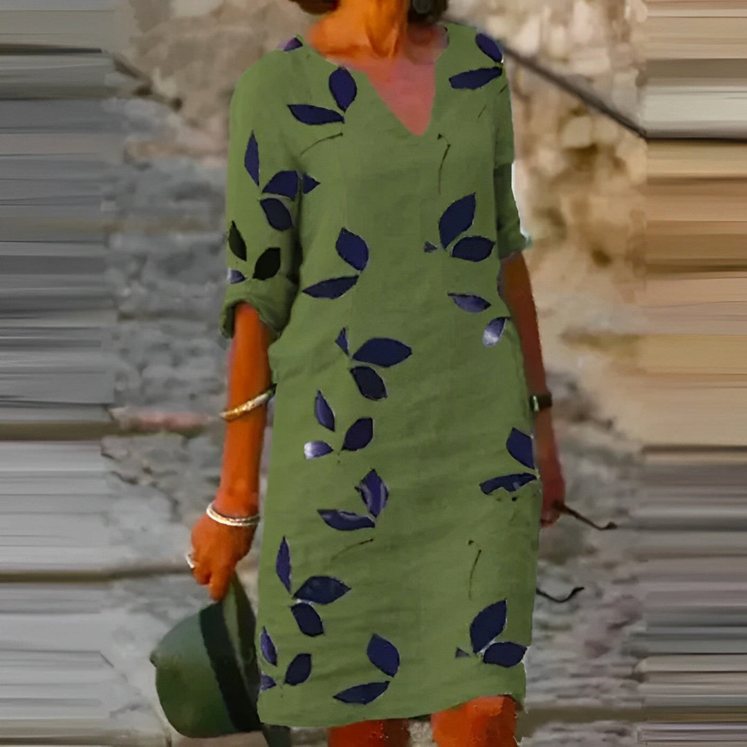 Chic women's leaf-print midi dress with a flowing silhouette, ideal for elegant autumn casual or day-to-night wear.