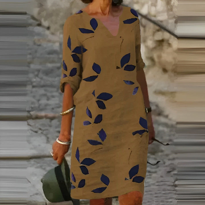Beautiful women's autumn leaf-print midi dress, featuring a graceful flowing design for effortless elegant style.